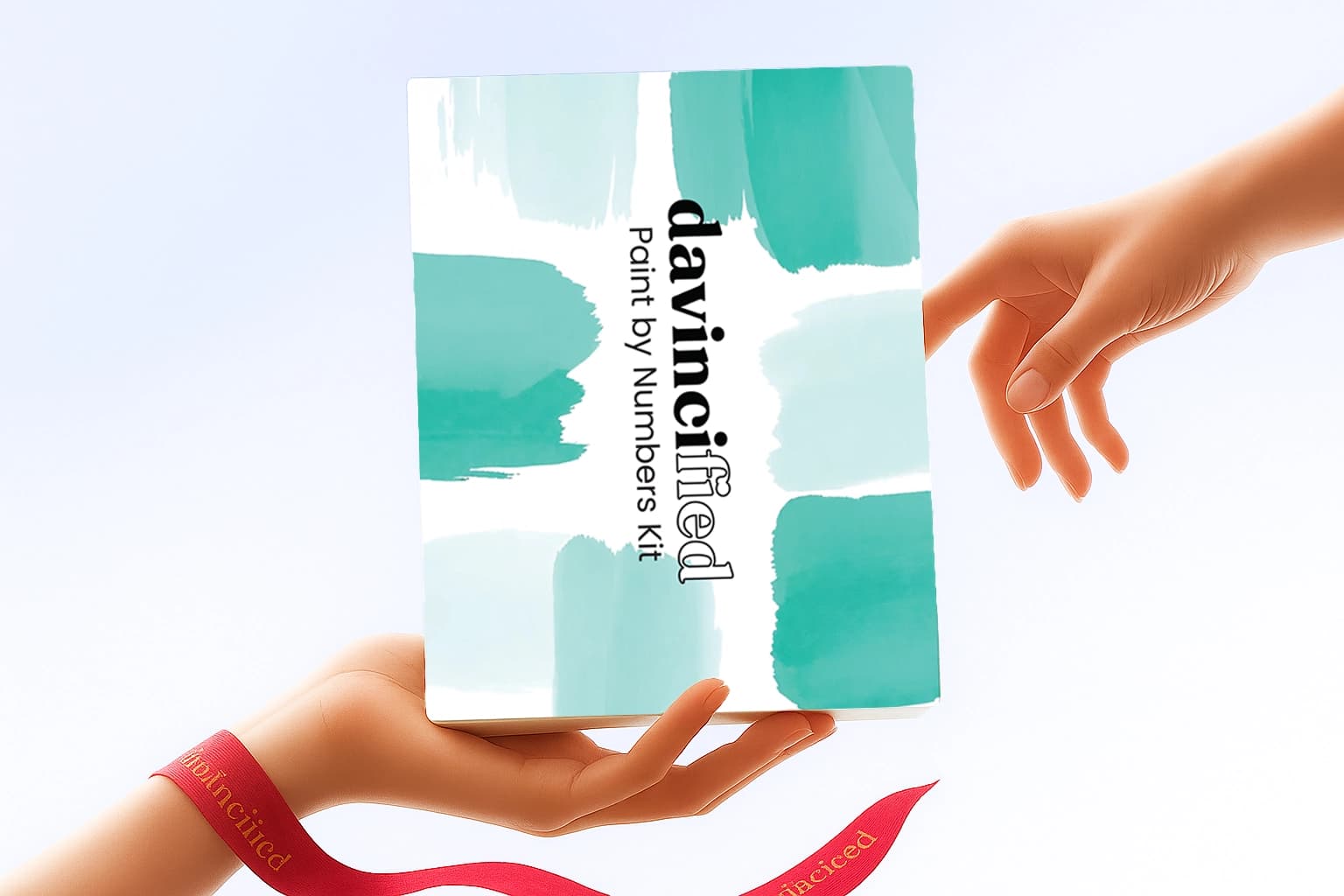Hands holding a davincified paint by numbers kit with teal abstract design
